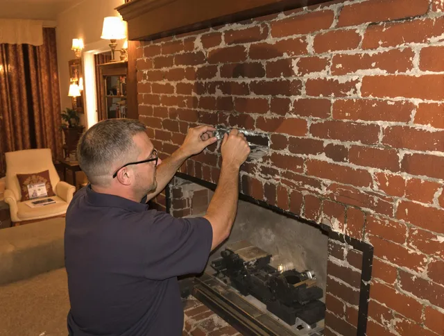 Security-Widefield Chimney Sweep expert fixing a fireplace in Security-Widefield, CO